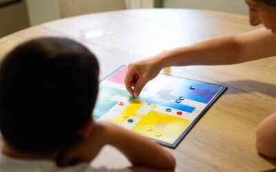Mother and son enjoying a board game session together